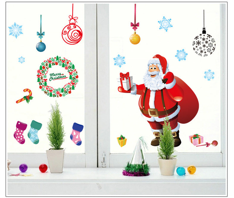 Christmas decorations store window stickers displayed on a glass window inscribed with festive holiday designs
