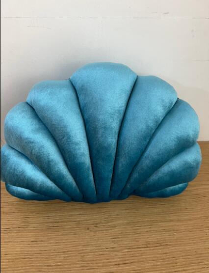 Simulation shell pillow cushion doll nap pillow in a seashell design, soft plush texture and rounded shape
