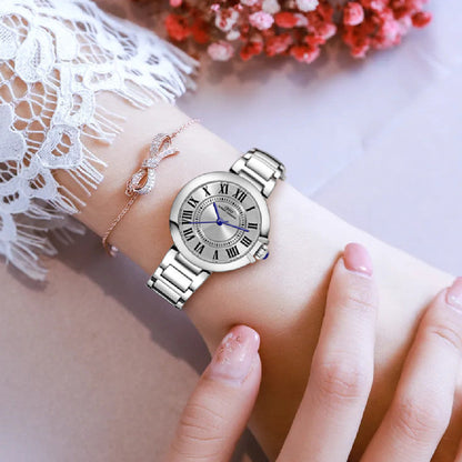 Women's Roman numeral steel band wristwatch with a round dial and metal bracelet
