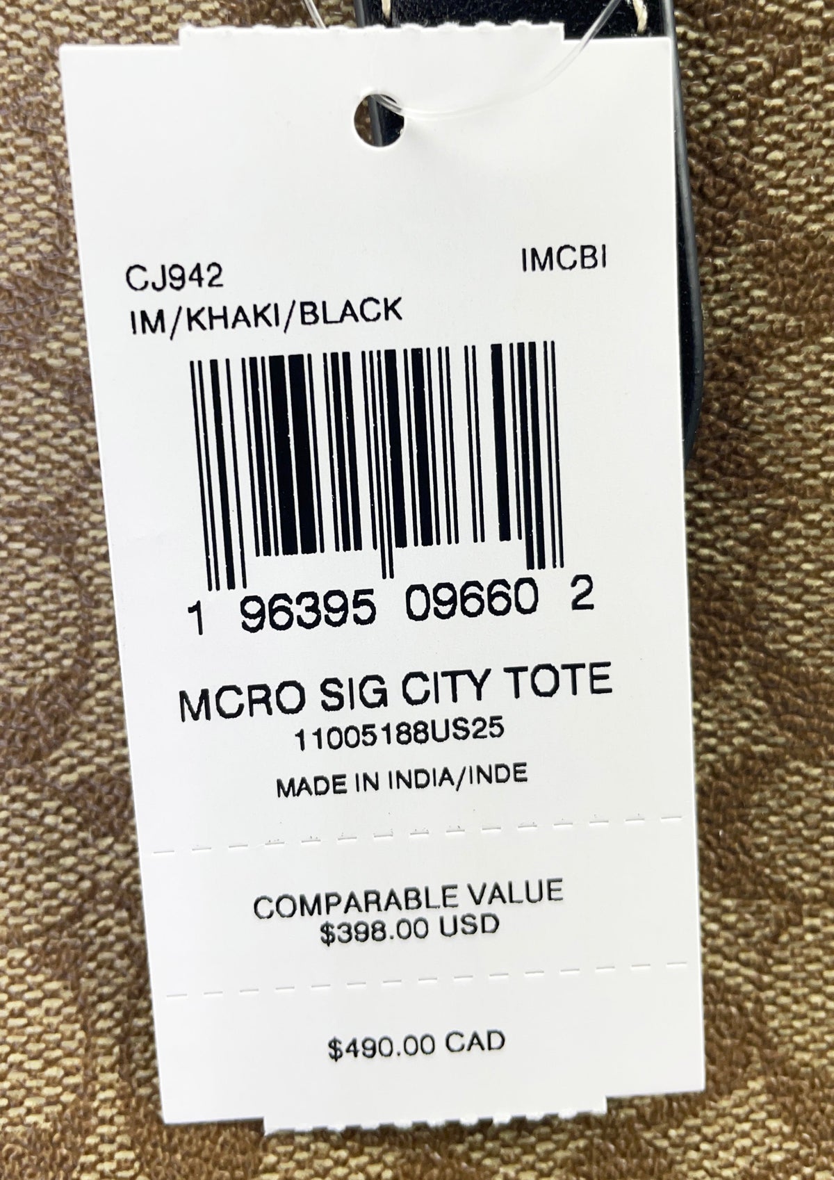 Coach CJ942 khaki Signature City tote bag with leather handles and spacious interior, stylish purse for everyday use.