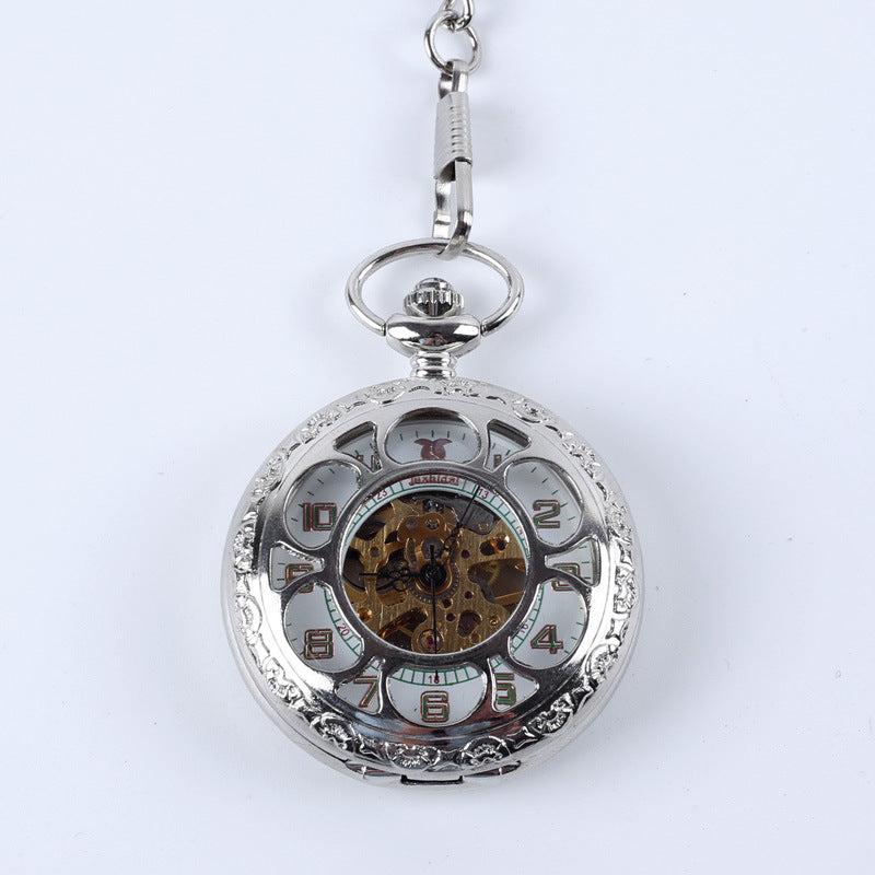 Vintage pocket watch with classic metal case and exposed dial, displayed against a plain background