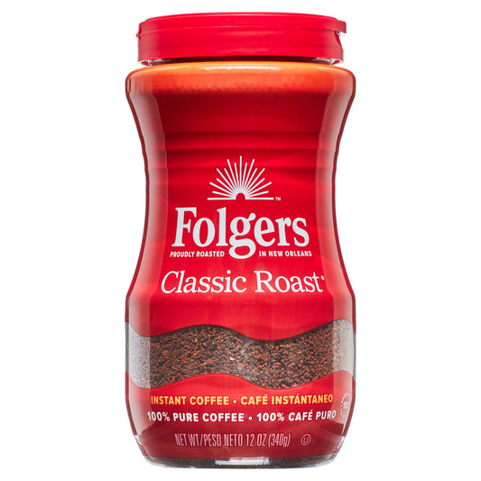 Folgers Classic Roast instant coffee crystals in a 12-ounce jar, featuring a label with coffee beans and brand logo.