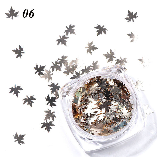 Gradient maple leaf nail sequins in orange and yellow tones for nail art
