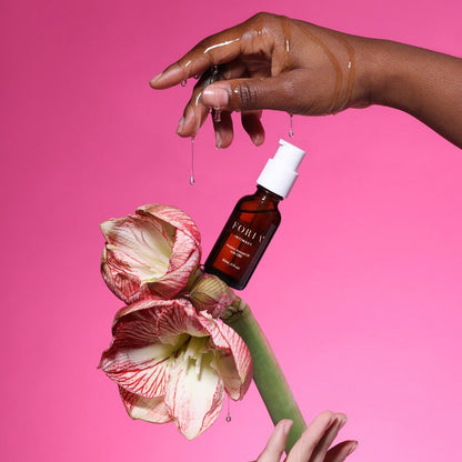 Foria Awaken Arousal Oil with CBD bottle and dropper, close-up shot showing the product label and packaging details.