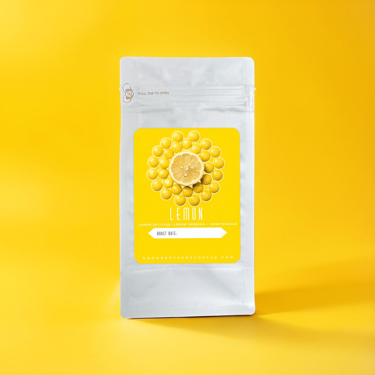 Roasted Colombia Caturra coffee beans from Good Brothers Coffee LLC displayed in a close-up image.