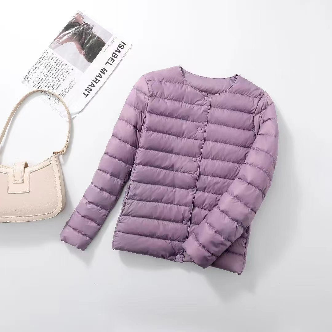 Women's lightweight white duck down jacket with quilted design and zip front