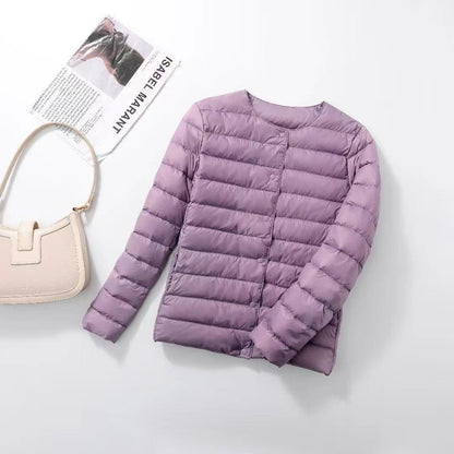 Women's lightweight white duck down jacket with quilted design and zip front