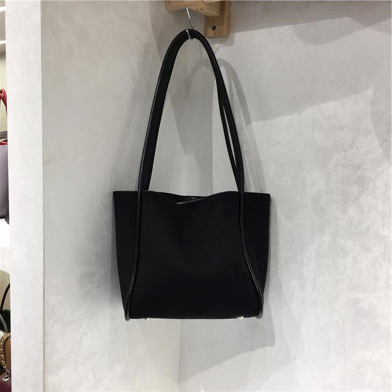 Suede casual shoulder tote bag in a simple design, shown from the front