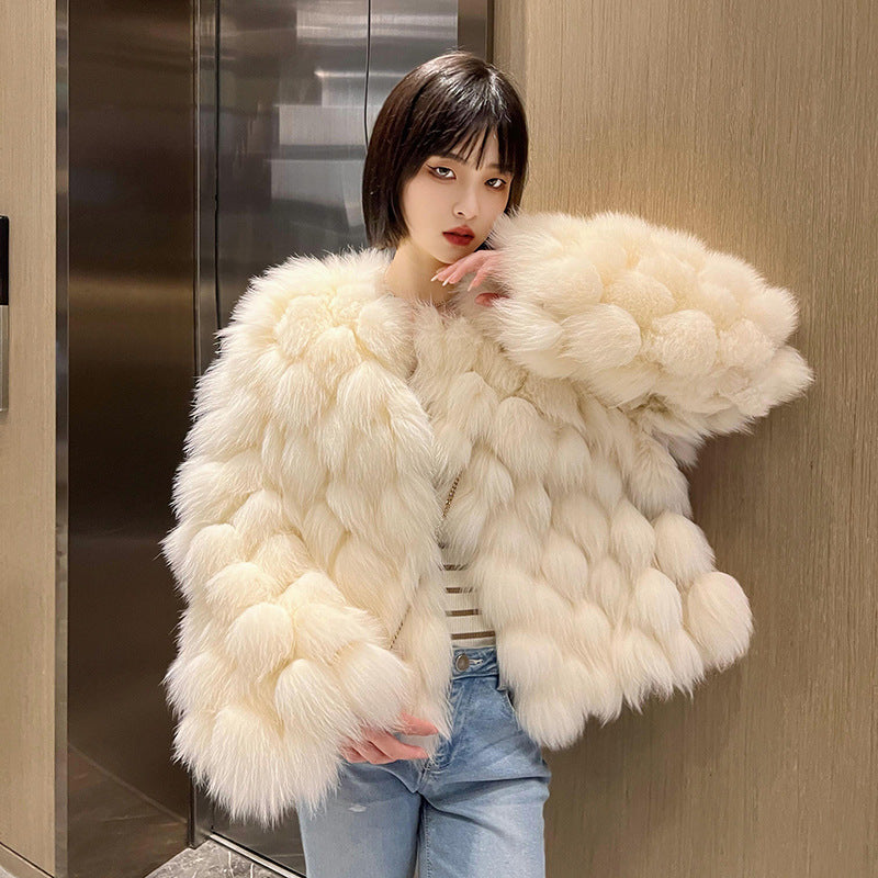 Women's winter faux fox fur coat in a plush, textured design