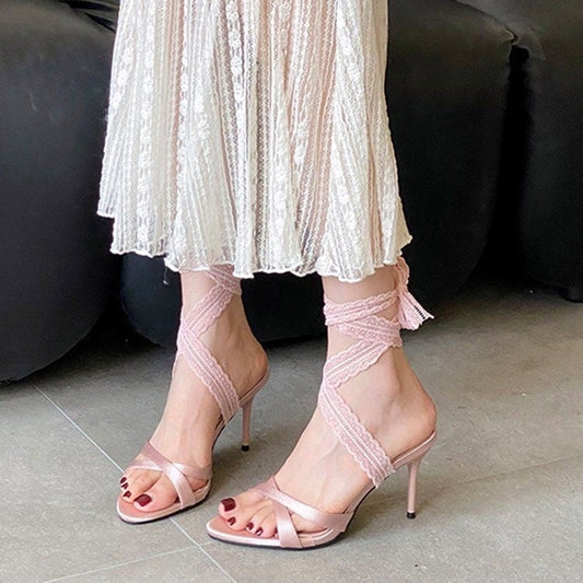 Women's black open toe lace-up Roman sandals with stiletto high heels and elegant strappy design