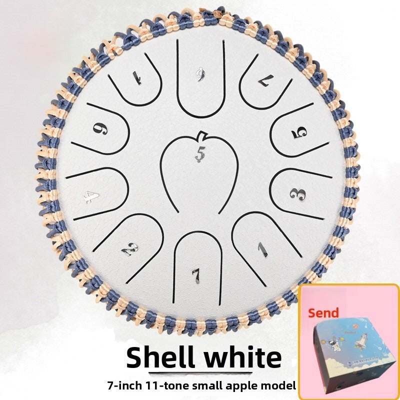 Apple-shell ethereal steel tongue drum with a rounded apple-shaped design, shown in detail