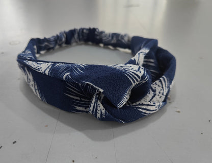 Women's retro style printed headband with colorful patterned fabric and twisted front detail