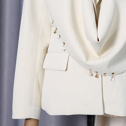 Waterfall draped pearl crystal bead trim asymmetrical tailored blazer in black, front view