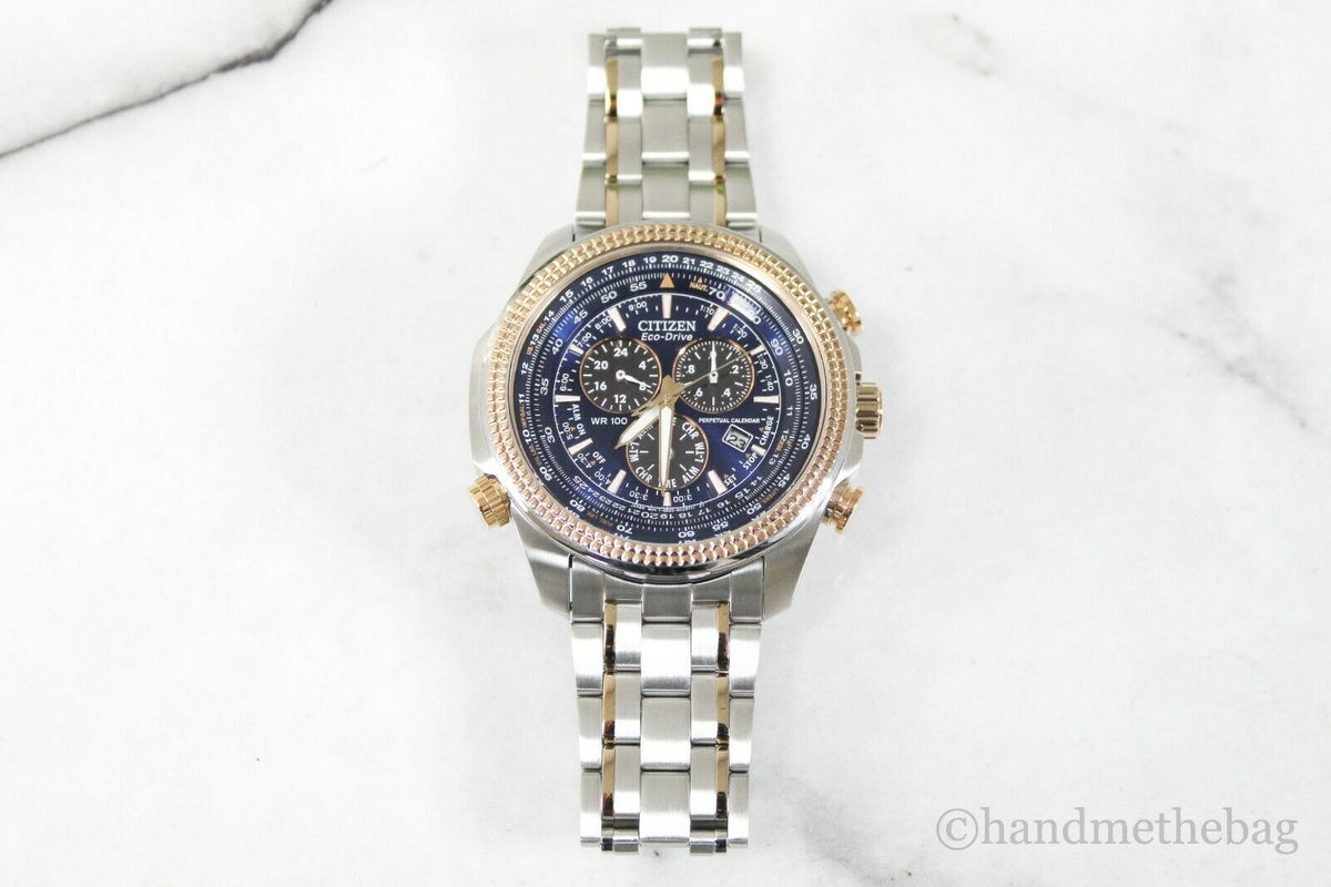 Citizen Eco Drive men's chronograph watch with two-tone stainless steel band and black dial, featuring multiple subdials and silver accents.