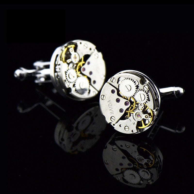 Mechanical movement French shirt cufflinks with intricate gear design and polished metal finish