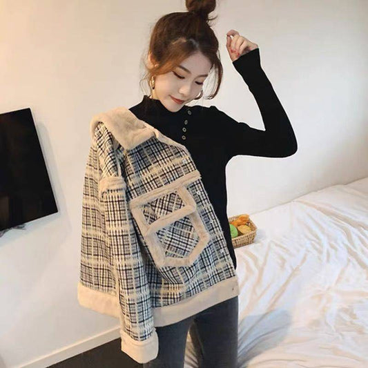Women's lamb plush fur coat in a soft, textured design.