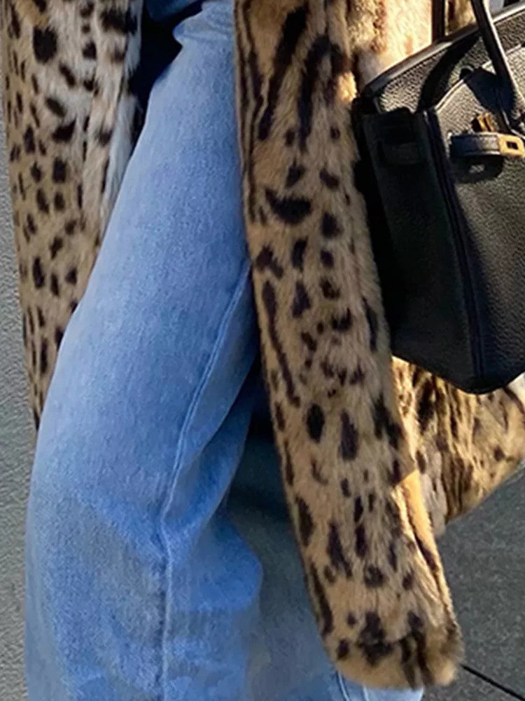 Women’s leopard print faux fur coat with long sleeves and a plush textured finish