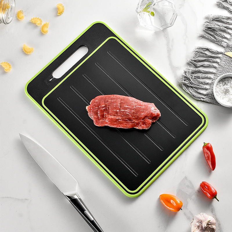 Double-sided cutting board with defrosting tray, knife sharpener, and grinding surface for kitchen use