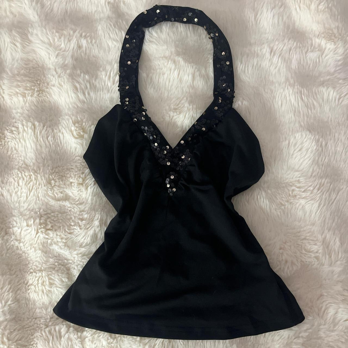 Women's sequined halter-neck V-neck sleeveless top in a shimmering design