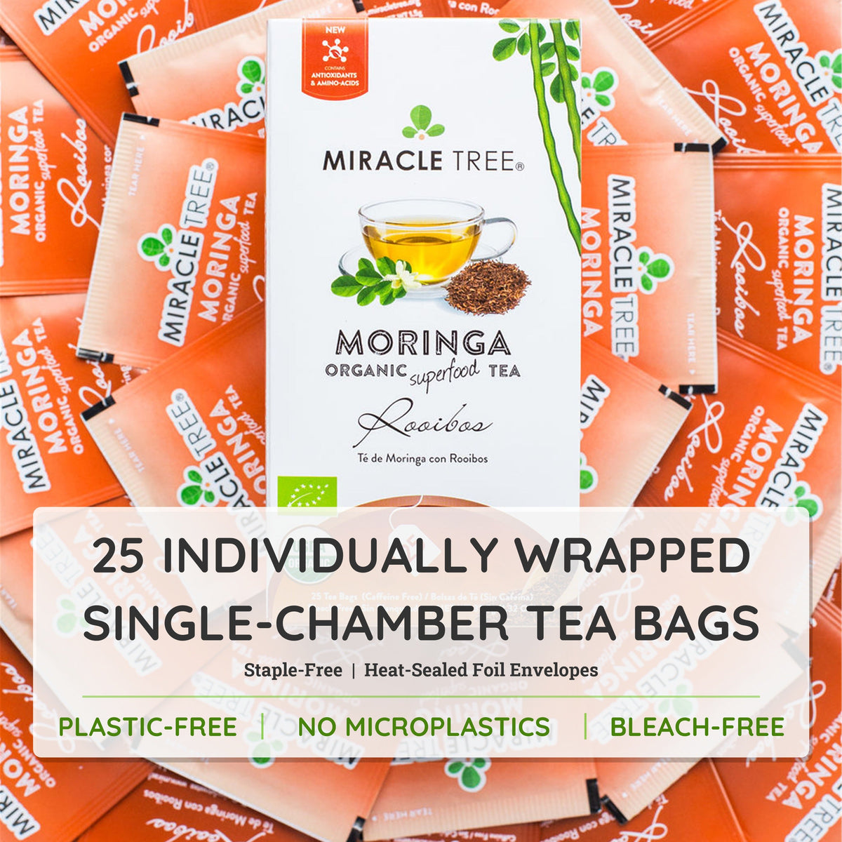 Bottle of Miracle Tree organic Moringa and Rooibos herbal tea with tea leaves and packaging in the background.
