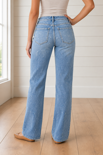 Back view of Threaded Pear Cameron Raw Hem Jeans showing distressed denim and raw hem detail.