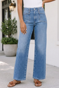 Light blue Tinsley high waist jeans by Threaded Pear with classic five-pocket design and belt loops.