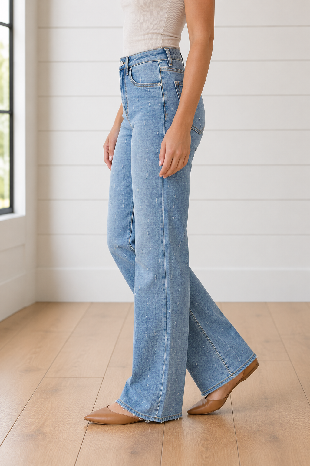 Light blue Cameron Raw Hem Jeans by Threaded Pear showing the distressed raw hem and classic five-pocket design.