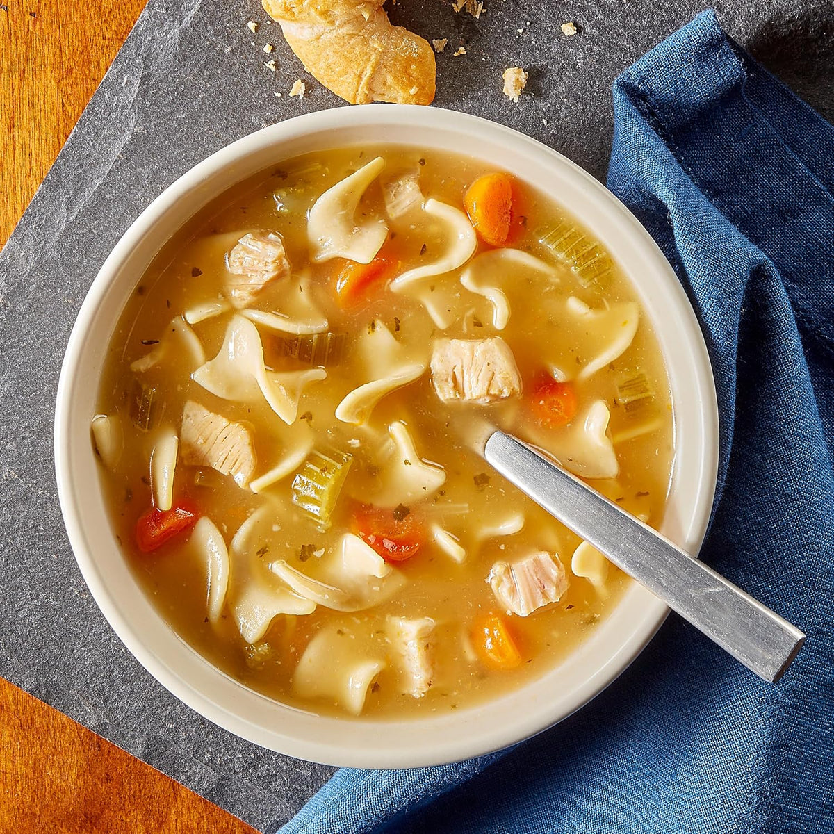Canned Progresso Traditional Chicken Noodle Soup 19 oz pack, showing four cans with labels and soup imagery