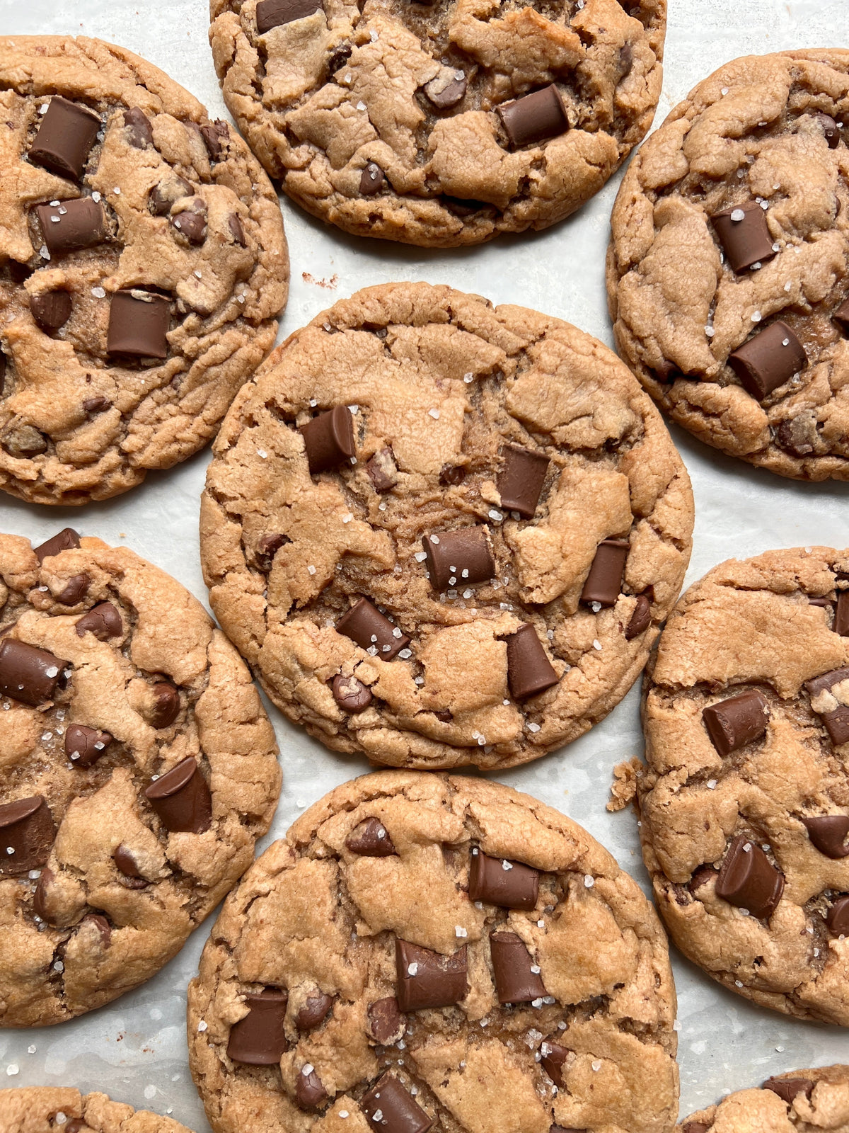 Let's Get Baked Artisan Desserts salted chocolate chunk cookies with visible chocolate chunks and a golden-brown baked surface.