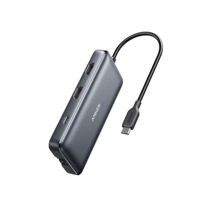 Anker 553 USB-C Hub 8-in-1 with multiple ports for charging, data transfer, and connectivity, shown connected to a laptop.
