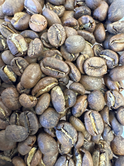 Roasted Peru Cajamarca coffee beans from Good Brothers Coffee LLC, showcasing rich brown beans in a close-up image.