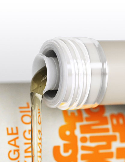 Bottle of Algae Cooking Oil from Algae Cooking Club, showcasing clear oil in a sleek container on a white background.