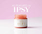 Kismet Buff All-Natural Lip Scrub in a clear jar with a wooden spatula, showcasing its natural exfoliating ingredients.