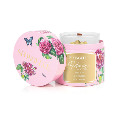Botanica Candle by Spongellé featuring a rose scent, elegant glass jar with a white candle inside for home fragrance.