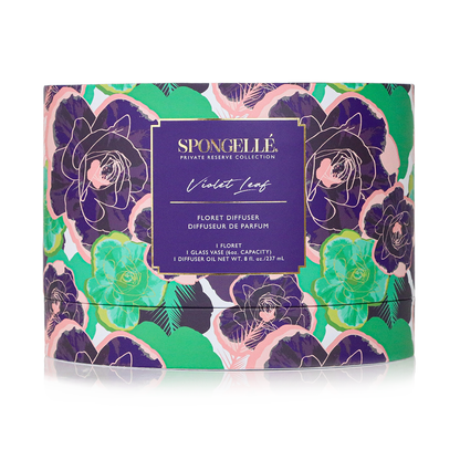 Violet Leaf private reserve diffuser by Spongellé, a home fragrance with a glass vessel and reed sticks for aromatic scent.