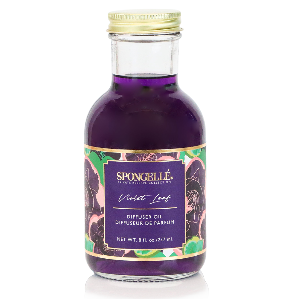 Violet Leaf Diffuser Oil from Spongellé's Private Reserve Collection in a clear bottle, used for home fragrance and ambient scenting.