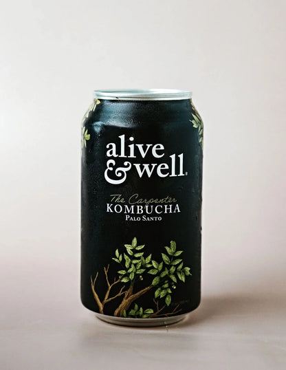 Alive & Well Kombucha Palo Santo flavor 6-pack, showing bottles with labels and natural wooden accents in the image.