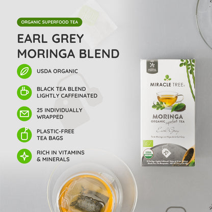 Organic Moringa Earl Grey herbal tea from Miracle Tree, showcasing dried tea leaves and citrus aroma in a natural setting.