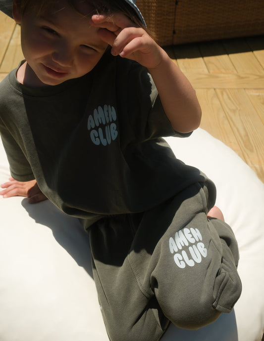 Bright yellow kids' T-shirt by Elevated Faith with "Amen Club" logo and colorful design, perfect for young children.