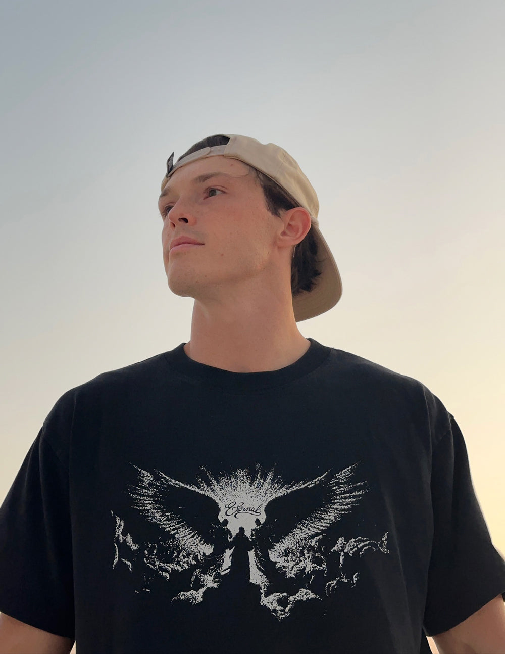 Elevated Faith Angels Heavyweight T-Shirt featuring a detailed angel graphic on the front, made of durable fabric.