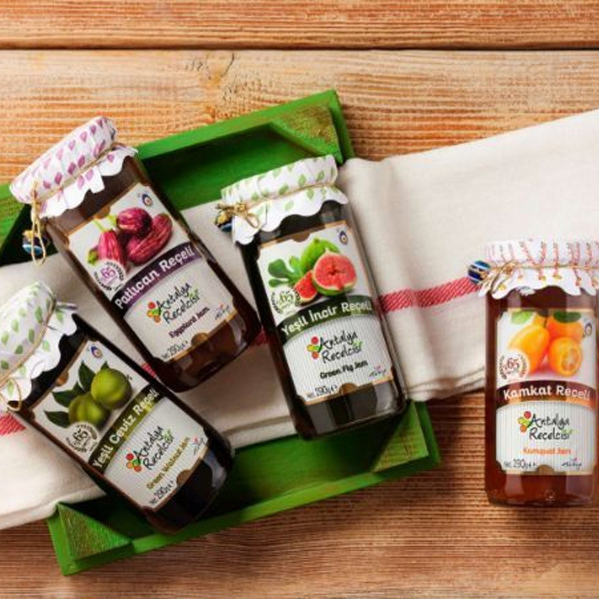 S101 Antalya Green Fig Jam 290g jar with green figs and jam spread visible, showcasing fresh fruit and vibrant green color.
