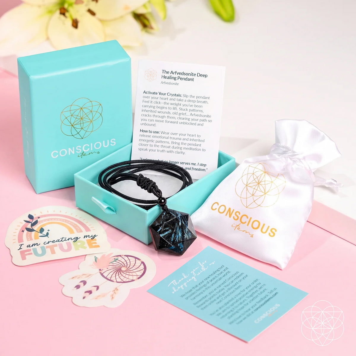 Deep healing Arfvedsonite pendant necklace by Conscious Items, shown with packaging and the polished stone pendant.