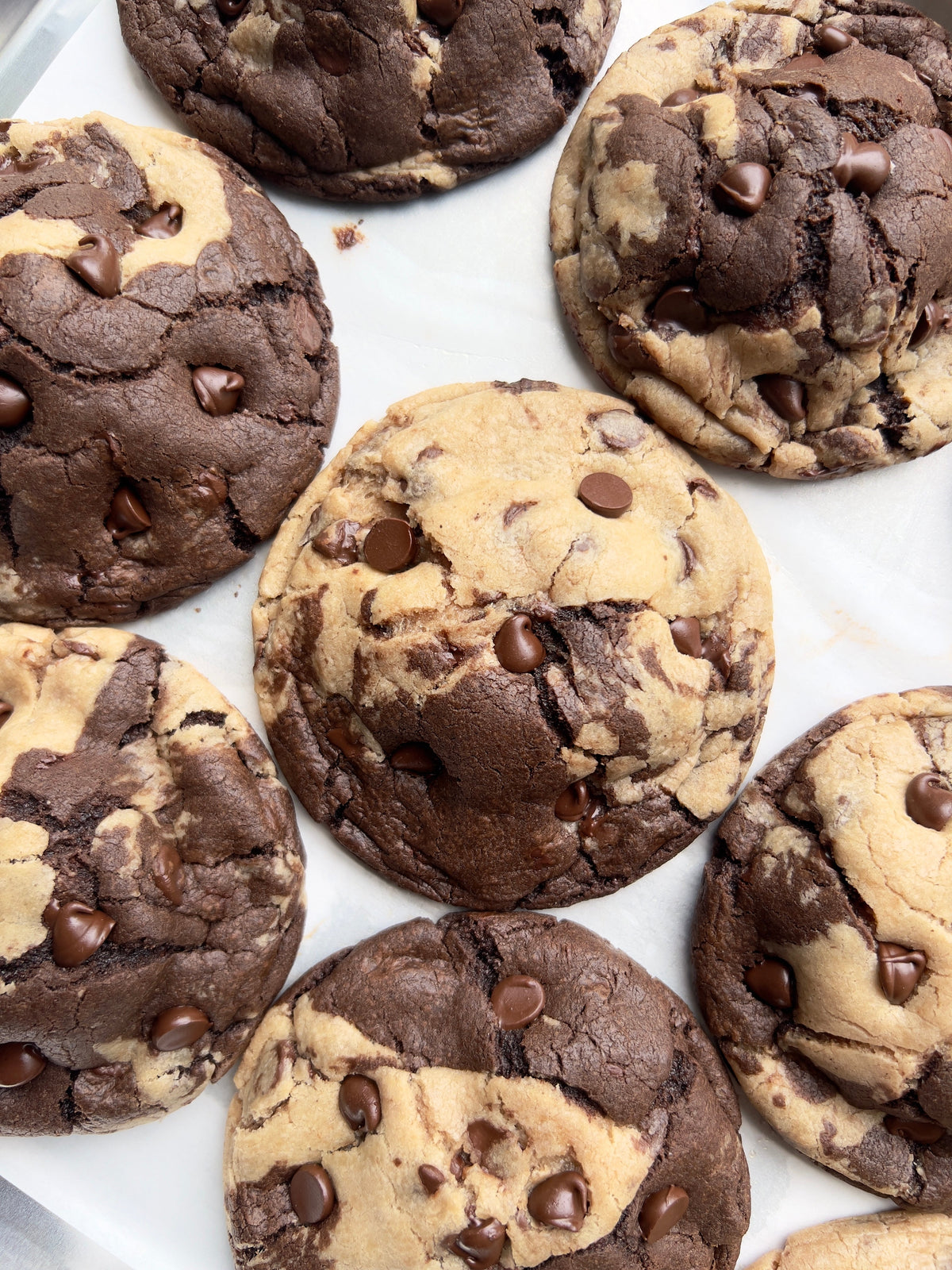 Let's Get Baked Artisan Desserts Brookie Monster 2.0 cookies with chocolate, nuts, and cookie dough in a close-up image.