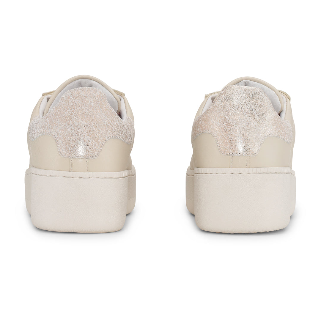 Beige ReyRey Special Edition sneakers with white soles and stylish design, shown from a side angle.