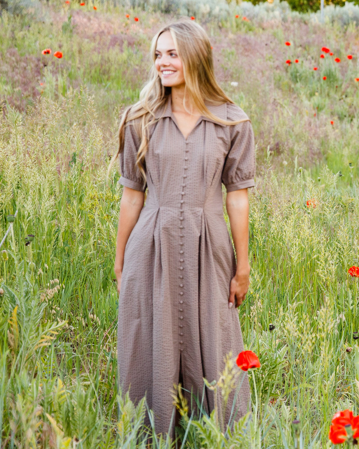 Downeast Femme Field Dress displayed on a hanger, featuring a casual, feminine style with earthy tones and button details.