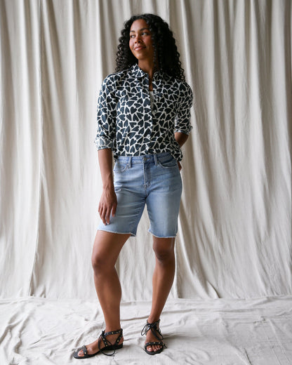 Downeast More Love top, casual women's blouse in soft fabric with a relaxed fit, displayed on a hanger.