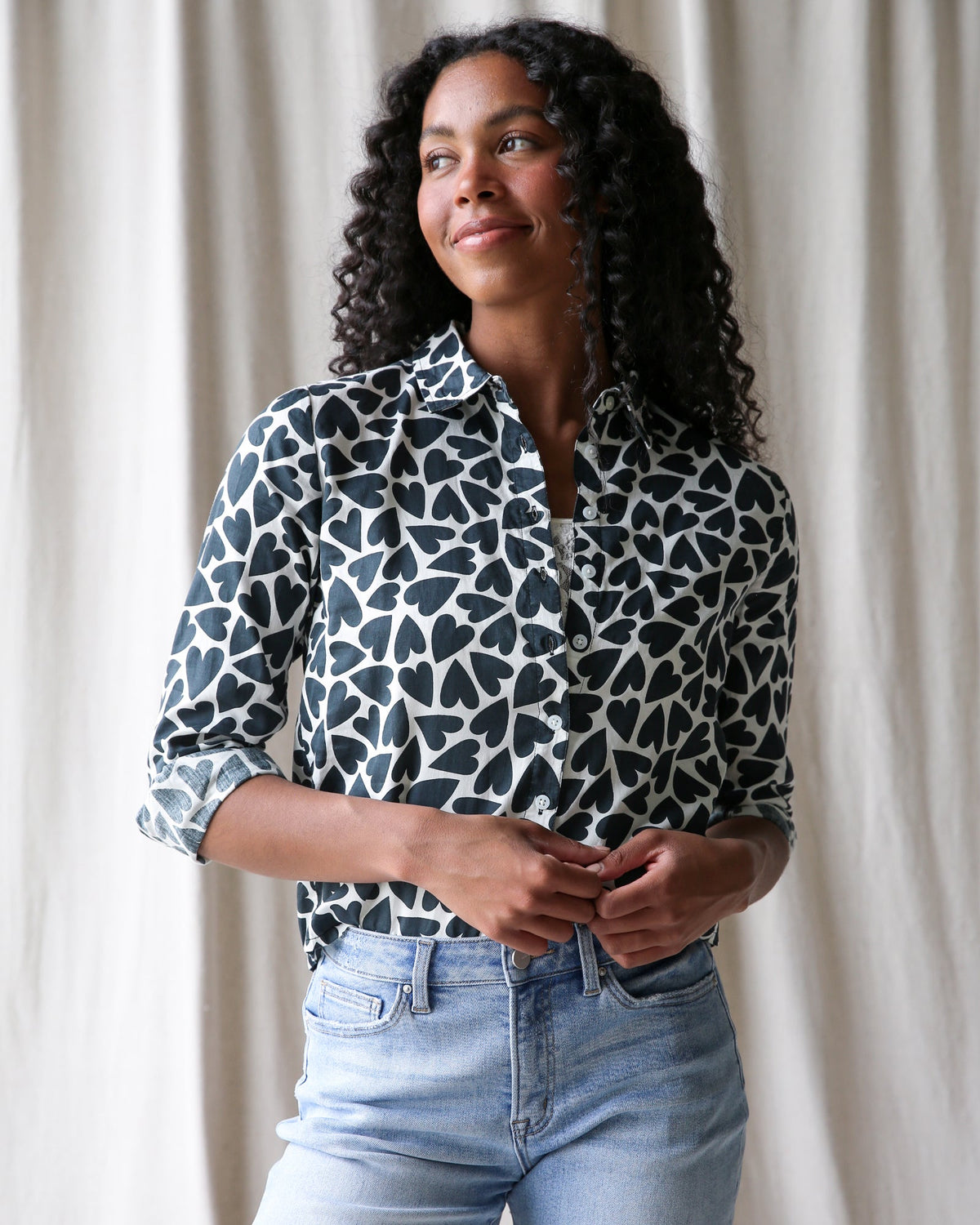 Downeast More Love Top, stylish women's blouse with ruffle details and floral pattern, shown in soft pastel colors.