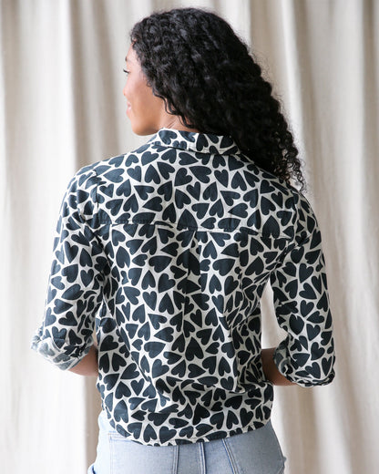 Downeast More Love top displayed on a hanger, featuring a casual, stylish design with soft fabric and a relaxed fit.