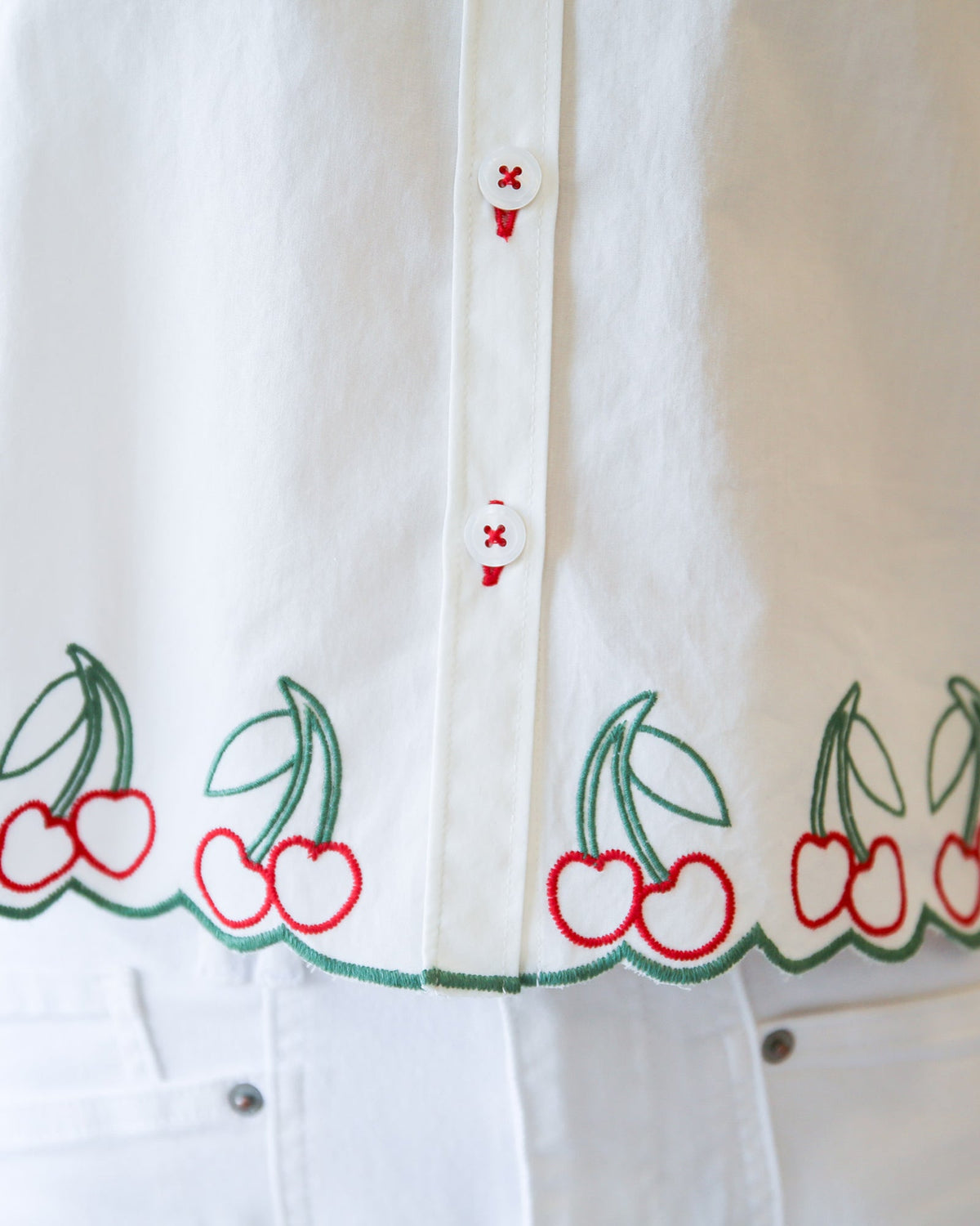Pink cherry print button-down top by Downeast, featuring a casual fit and long sleeves.
