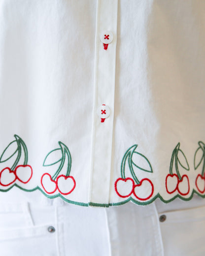 Pink cherry print button-down top by Downeast, featuring a casual fit and long sleeves.